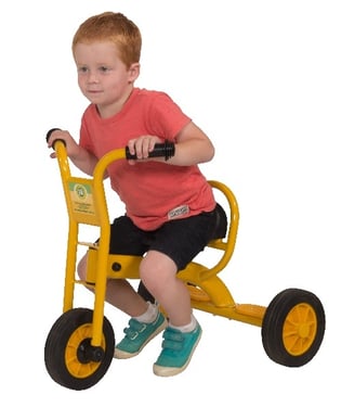 child riding a trike