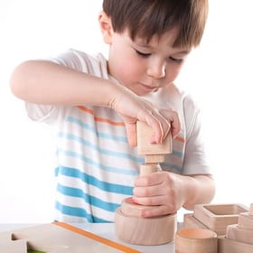 kid playing with building blocks